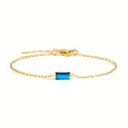 Waterproof gold bracelet with a blue rectangular glass in stainless steel.