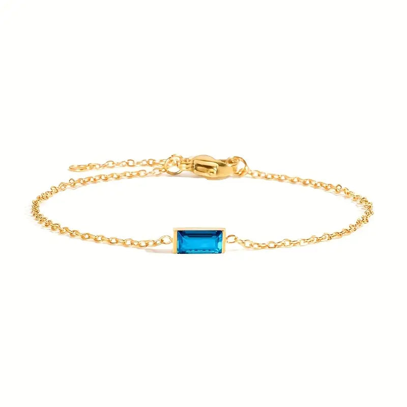Waterproof gold bracelet with a blue rectangular glass in stainless steel.