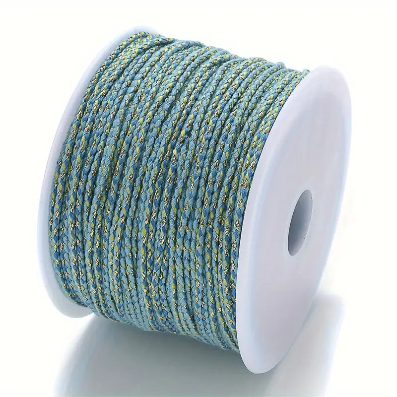 Spool of blue and gold braided cable to make customisable necklaces
