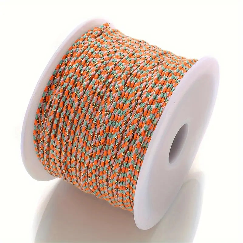 Spool of Orange and blue braided cable to make customisable necklaces