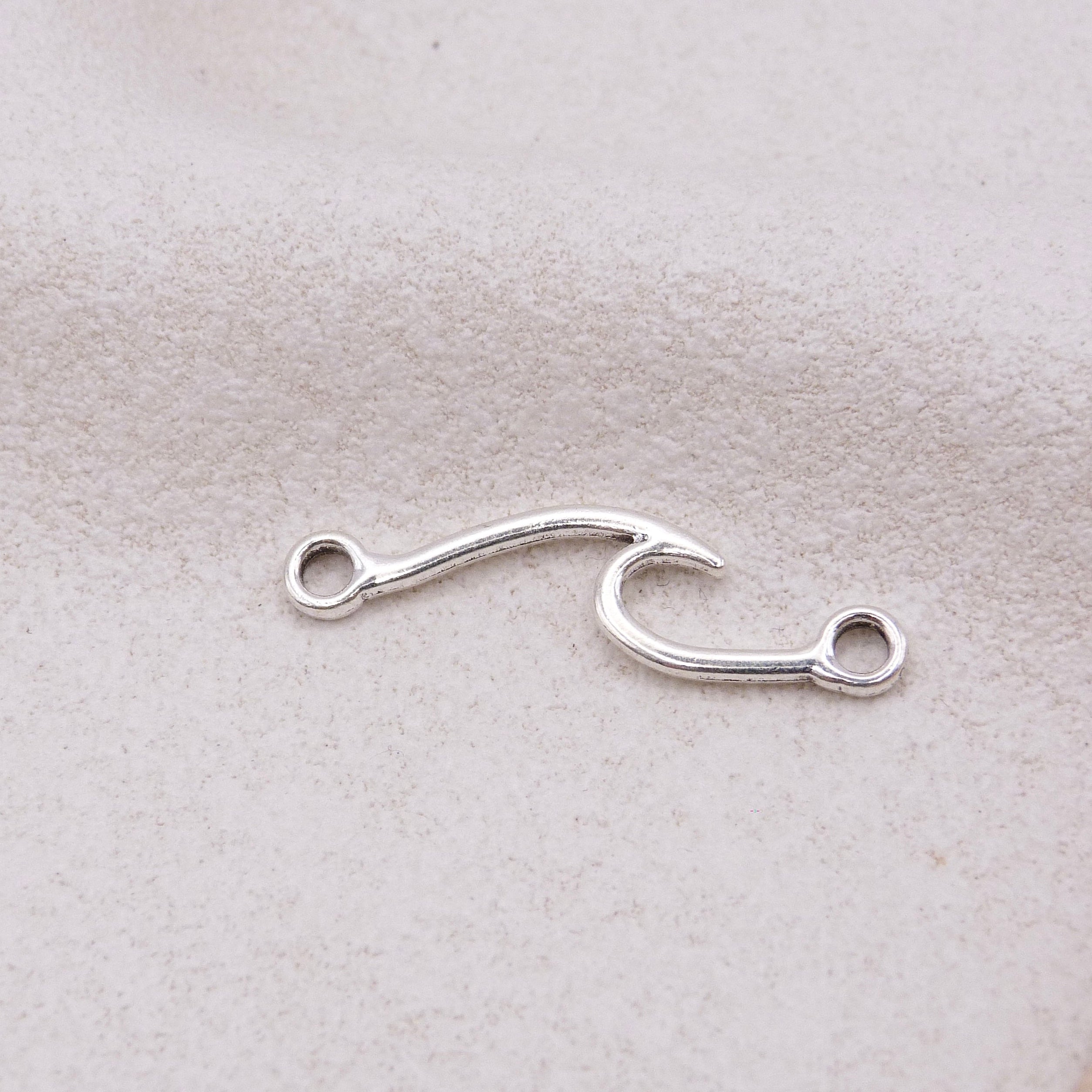 Silver wave charm