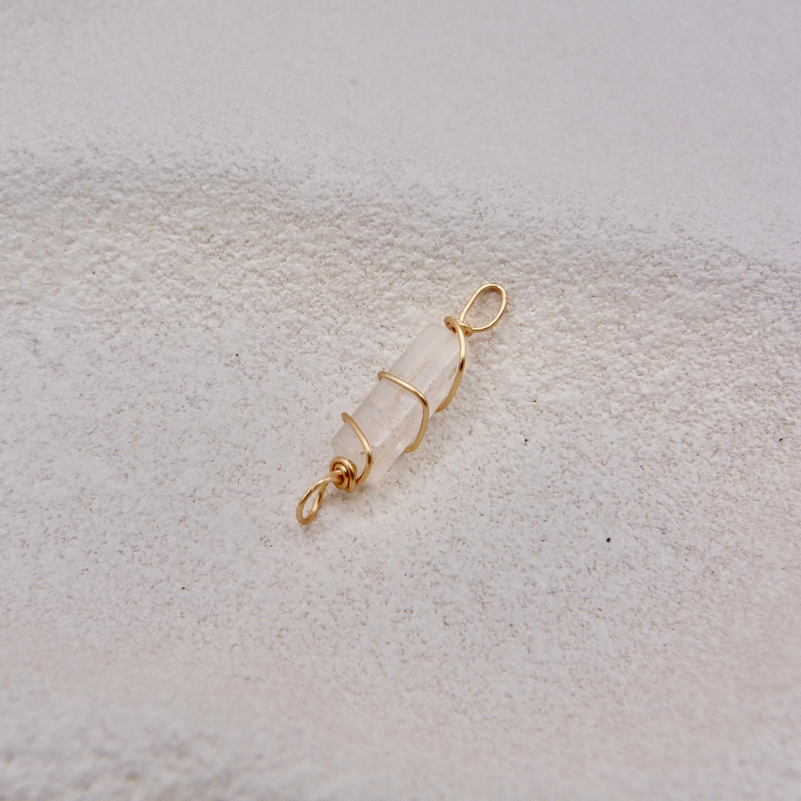 Gold wire-wrapped white clear crystal pendant