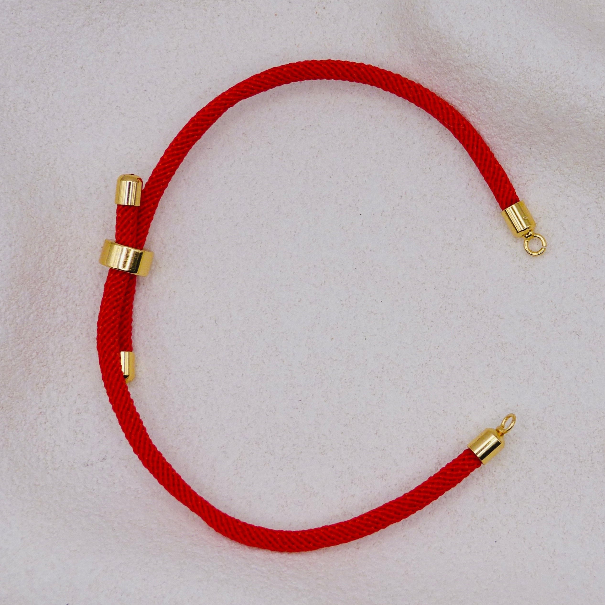 Red rope necklace with gold clasps. The bracelet has a gap to cutomise.