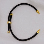 Black rope necklace with gold clasps. The bracelet has a gap to cutomise.