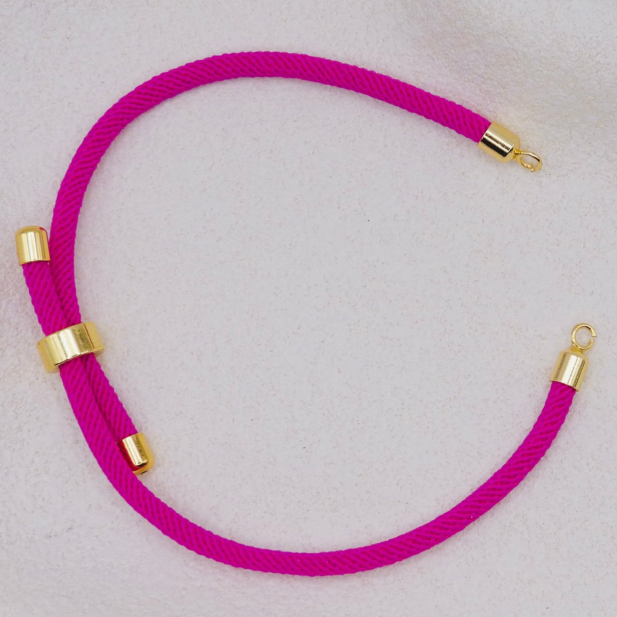 Hot Pink rope necklace with gold clasps. The bracelet has a gap to cutomise.