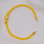 Yellow rope necklace with gold clasps. The bracelet has a gap to cutomise.
