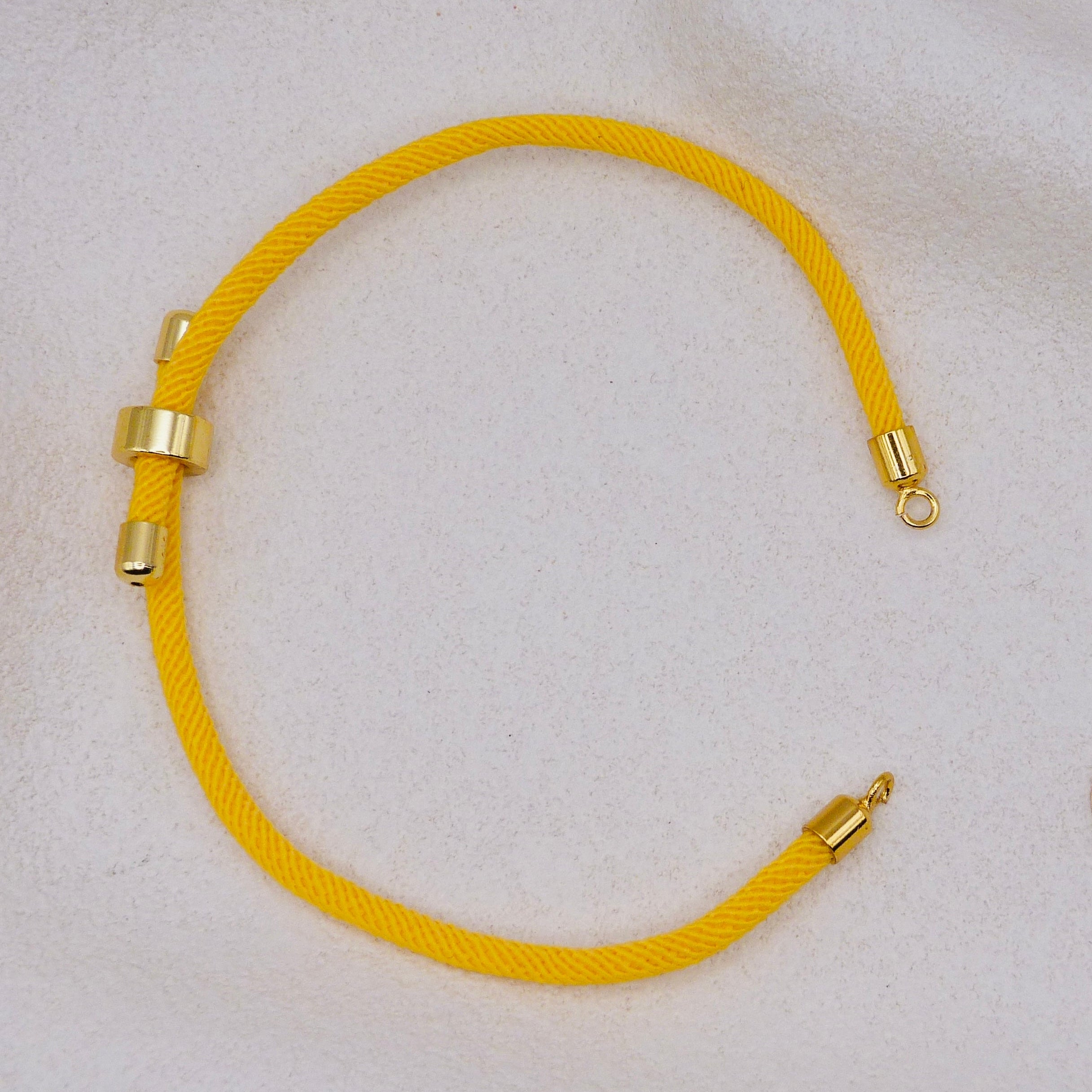 Yellow rope necklace with gold clasps. The bracelet has a gap to cutomise.
