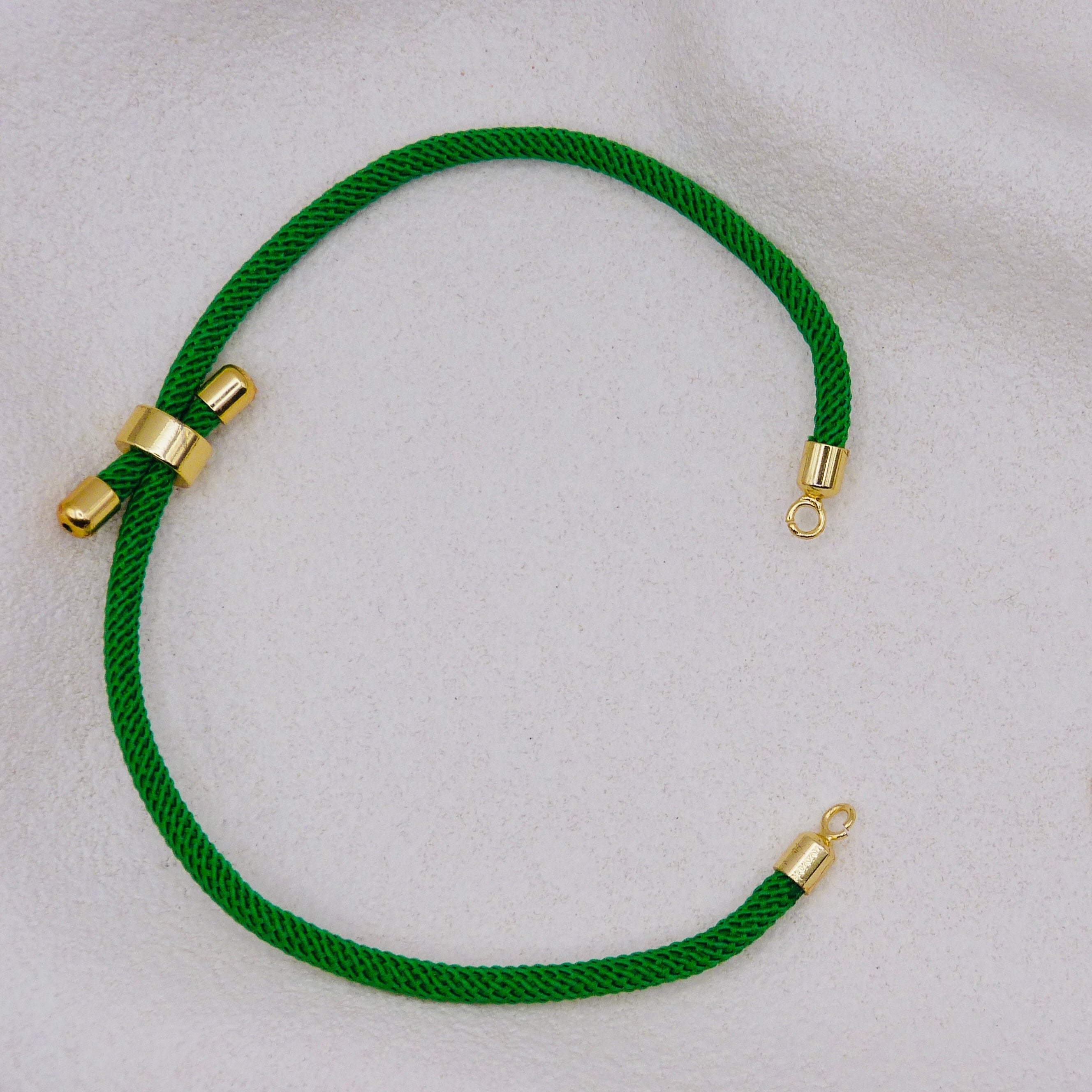 Green rope necklace with gold clasps. The bracelet has a gap to cutomise.