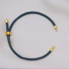 Gray rope necklace with gold clasps. The bracelet has a gap to cutomise.