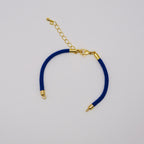 Waterpoof royal blue nylon bracelet with gold adjustable chain in stainless steel.