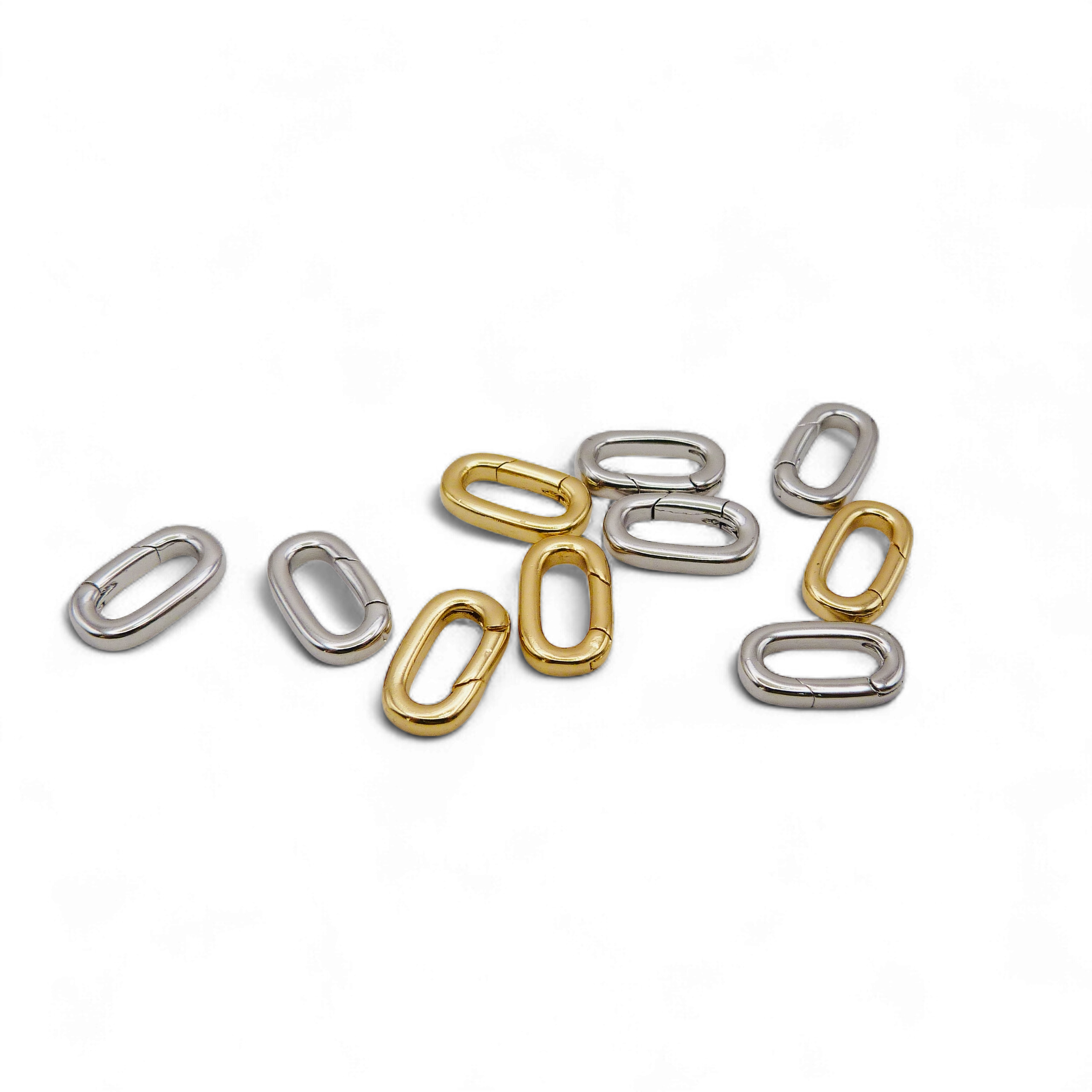 Silver and gold oval link charms for customisable waterproof chains, perfect for creating personalised jewellery.