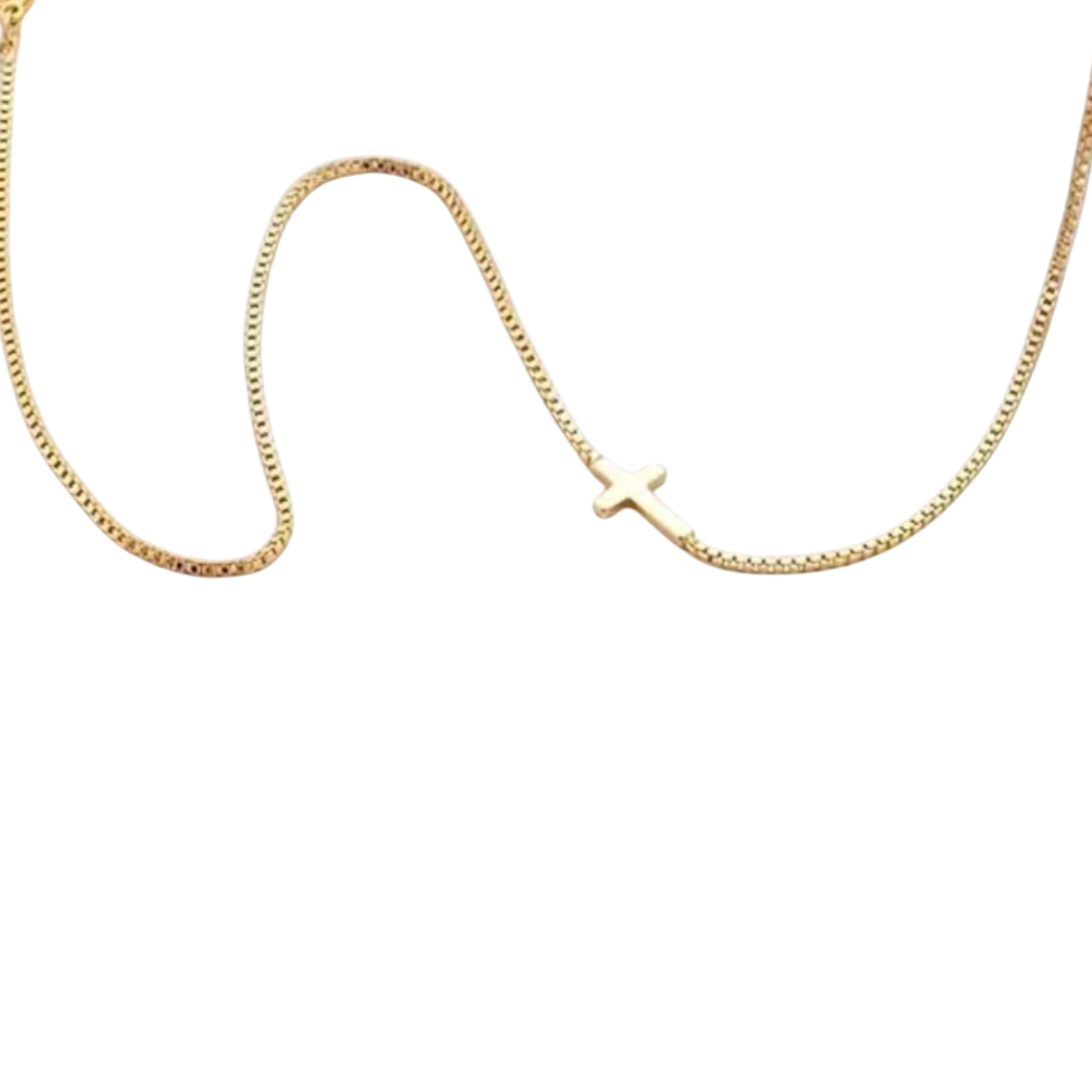 Gold chain necklace with a small cross charm in stainless steel.
