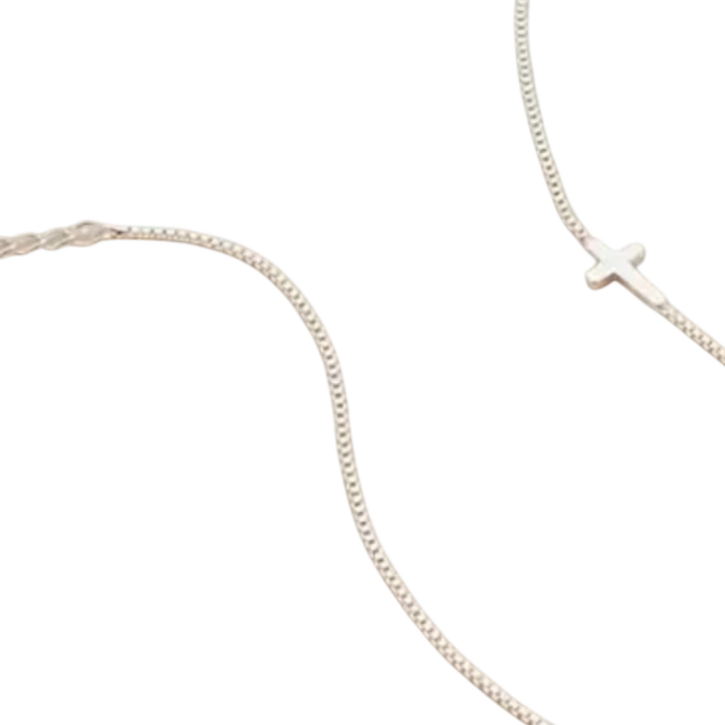 Silver necklace with a small cross pendant in stainless steel.
