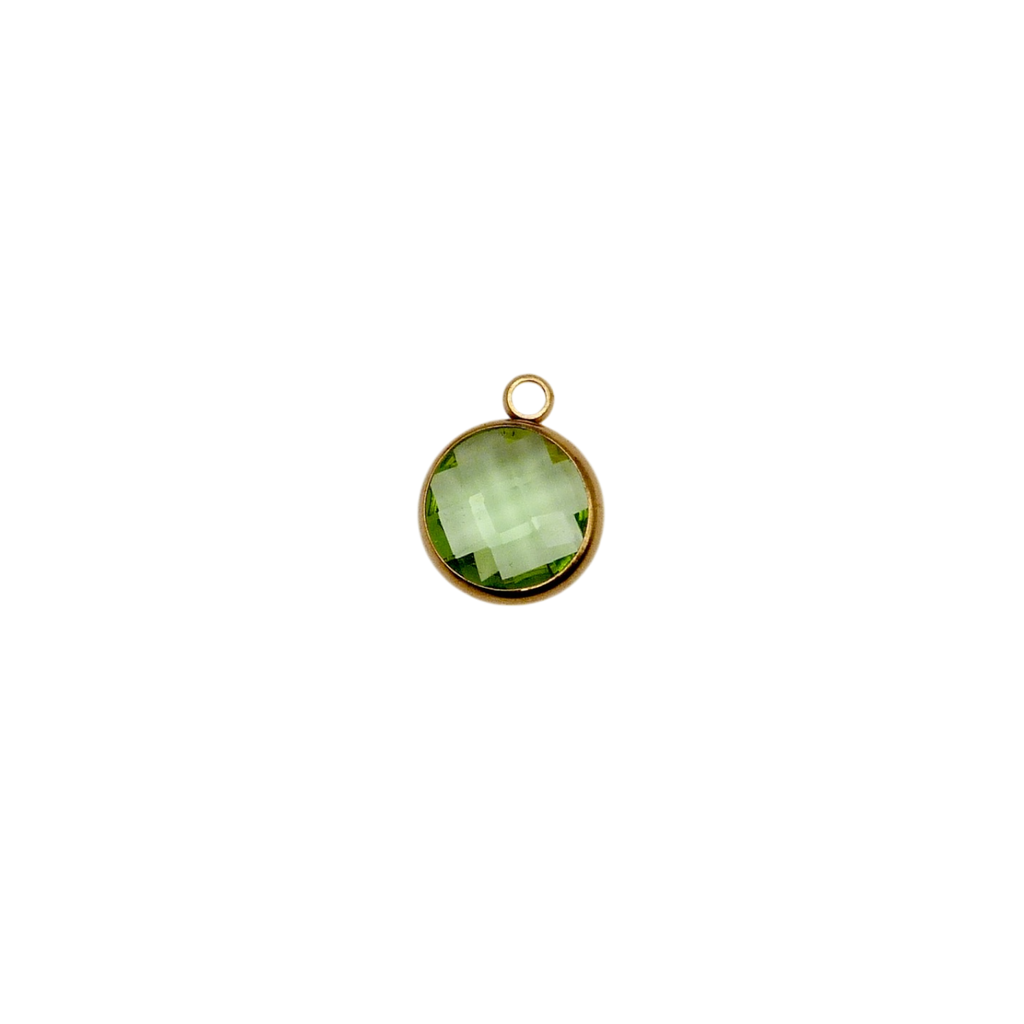 Green circular glass charm with waterproof gold frame.