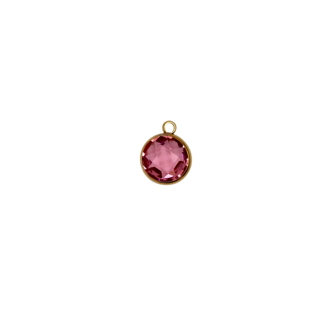 Pink circular glass charm with waterproof gold frame.