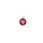 Pink circular glass charm with waterproof gold frame.