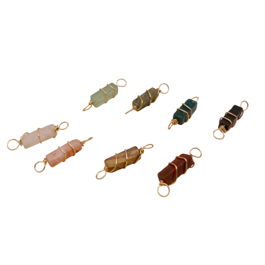 Set of rectangular crystal and gold wire wrapped pendants.