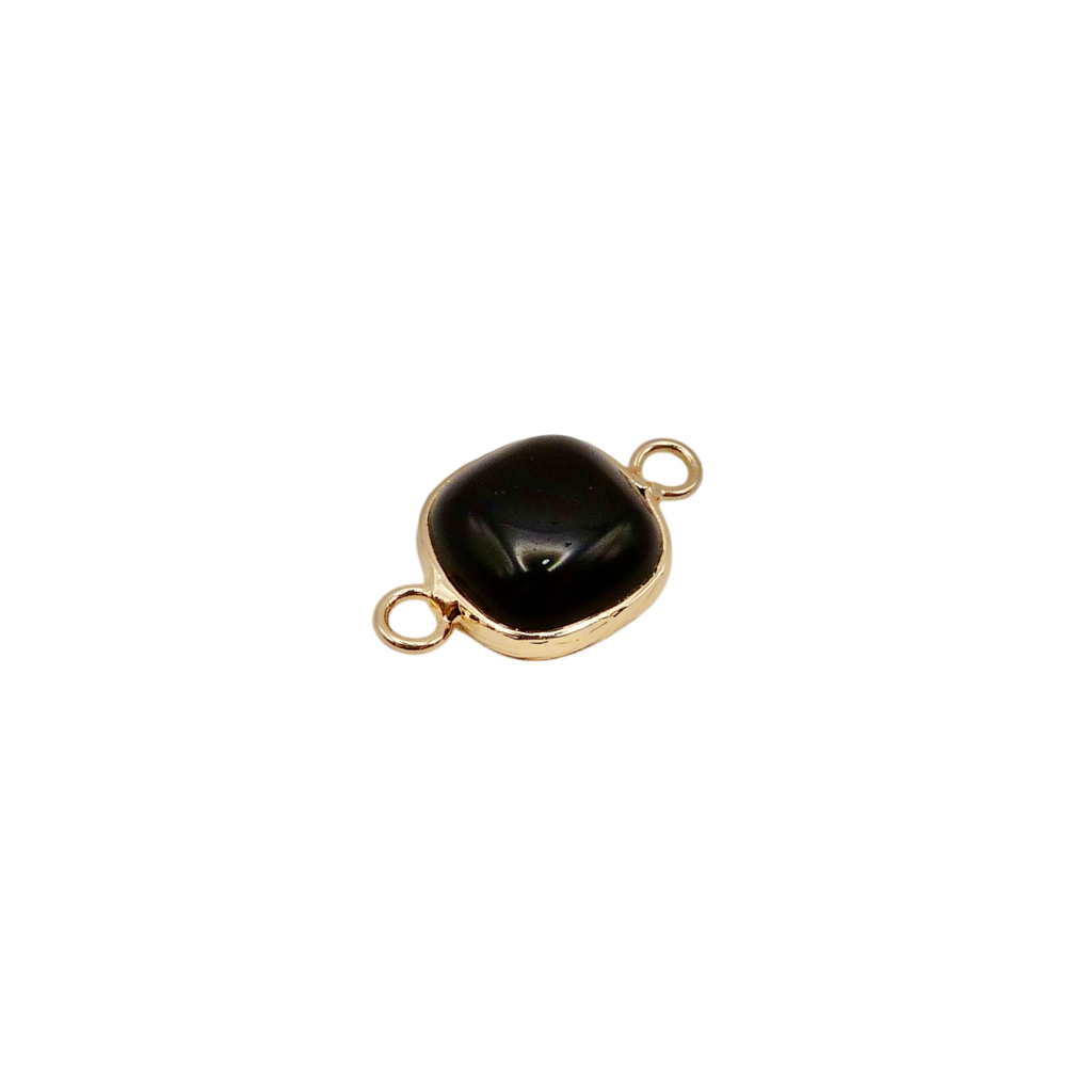 Waterproof gold frame jewelry connector with a black crystal.