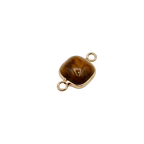 Waterproof gold frame jewelry connector with a brown crystal.