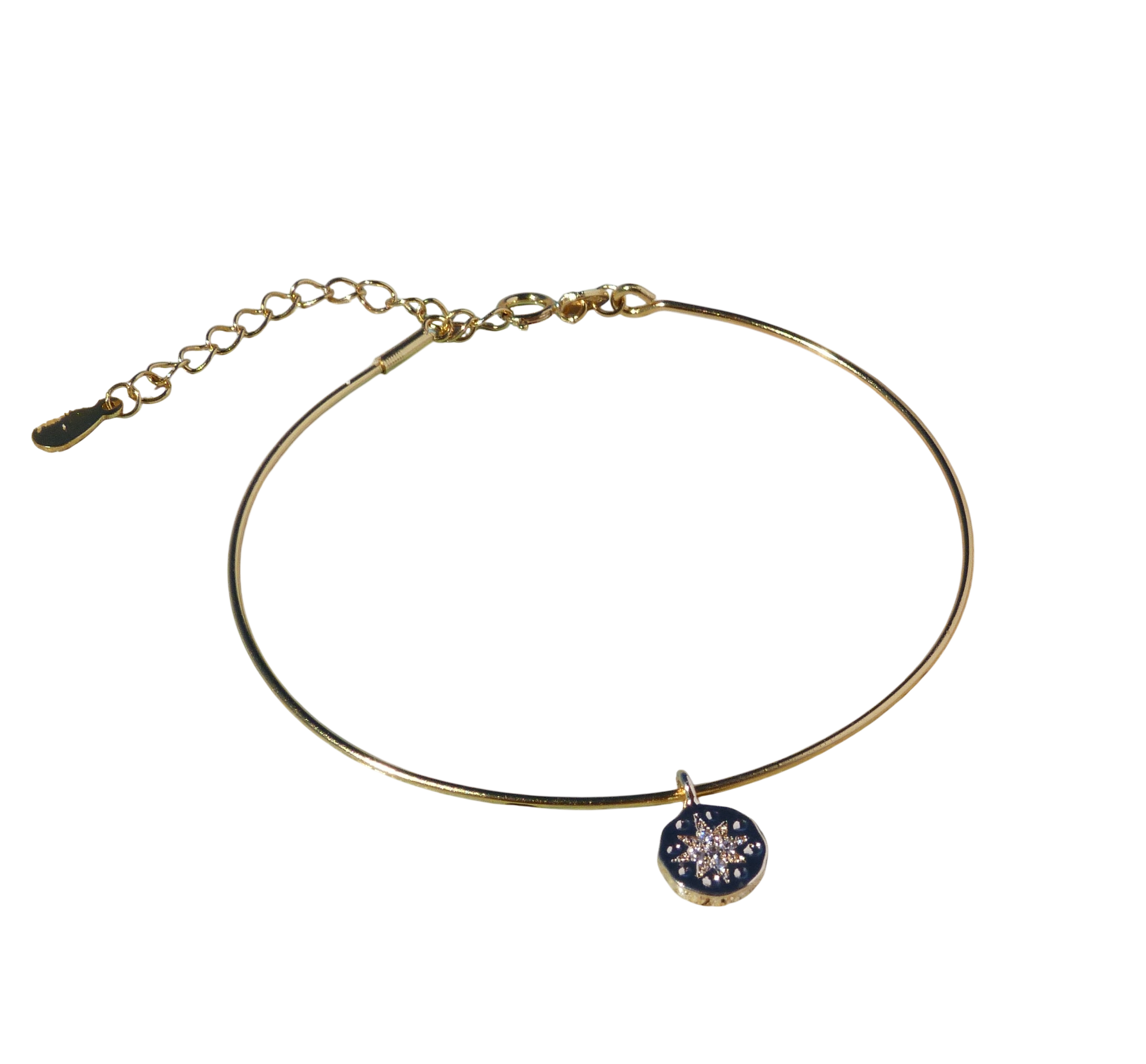 Gold bangle bracelet with a zirconia star charm.