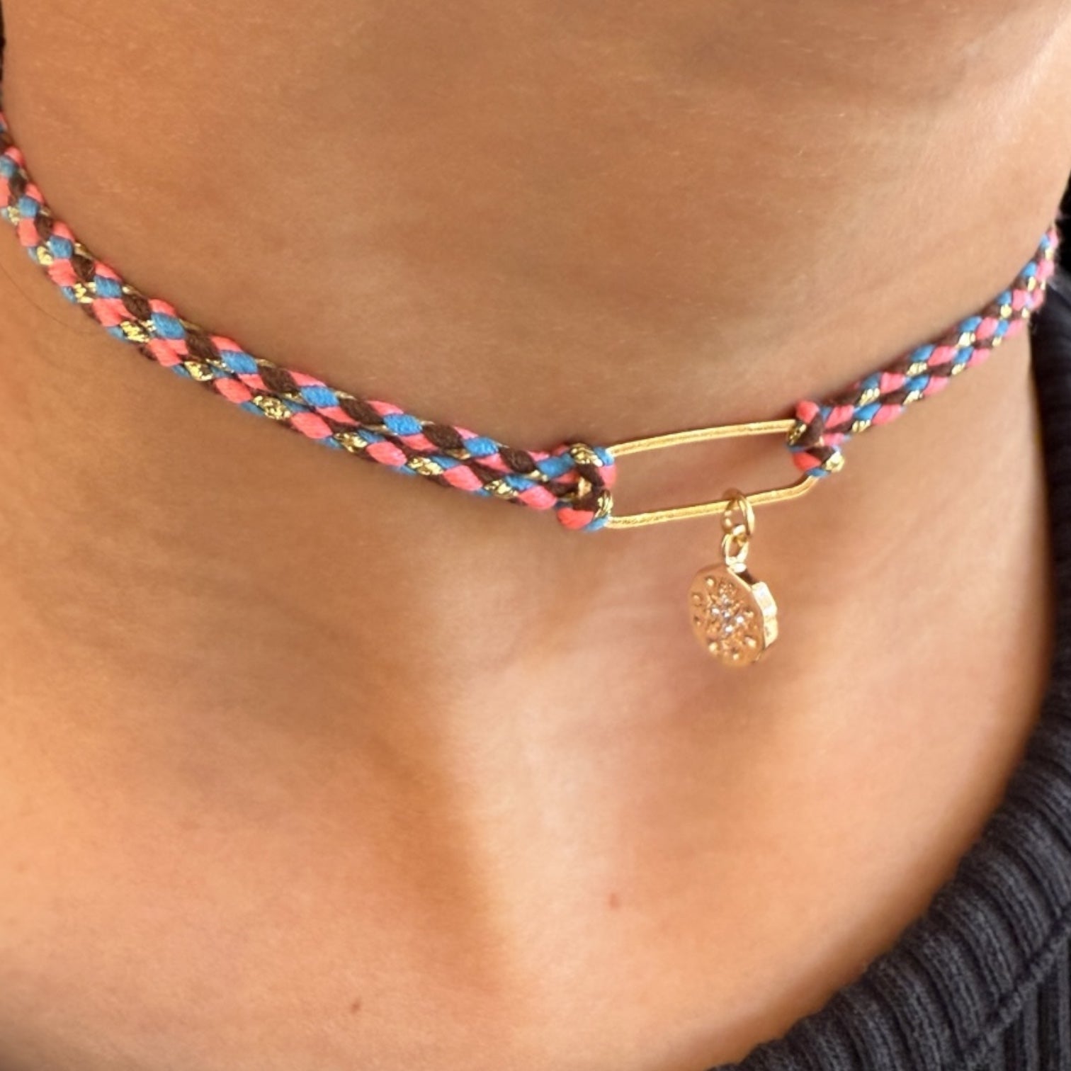 Customisable braided choker necklace with gold charm pendant.