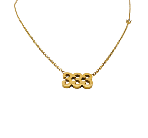 Gold necklace with the number '333' and small stone in stainless steel.