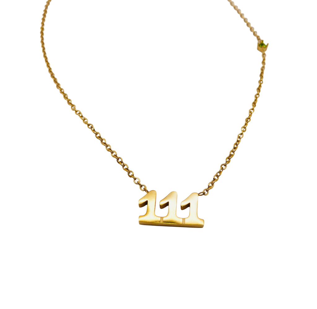 Waterproof gold chain necklace with the number '111' and a small green stone.