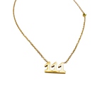 Waterproof gold chain necklace with the number '111' and a small green stone.