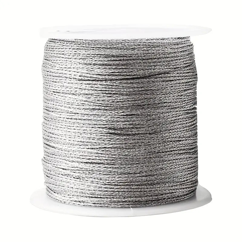 Spool of silver nylon thread for customisable bracelets.