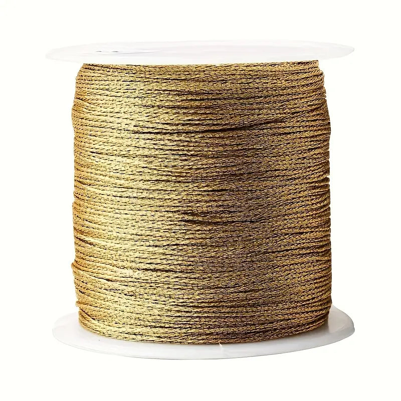 Spool of gold nylon thread for customisable bracelets.